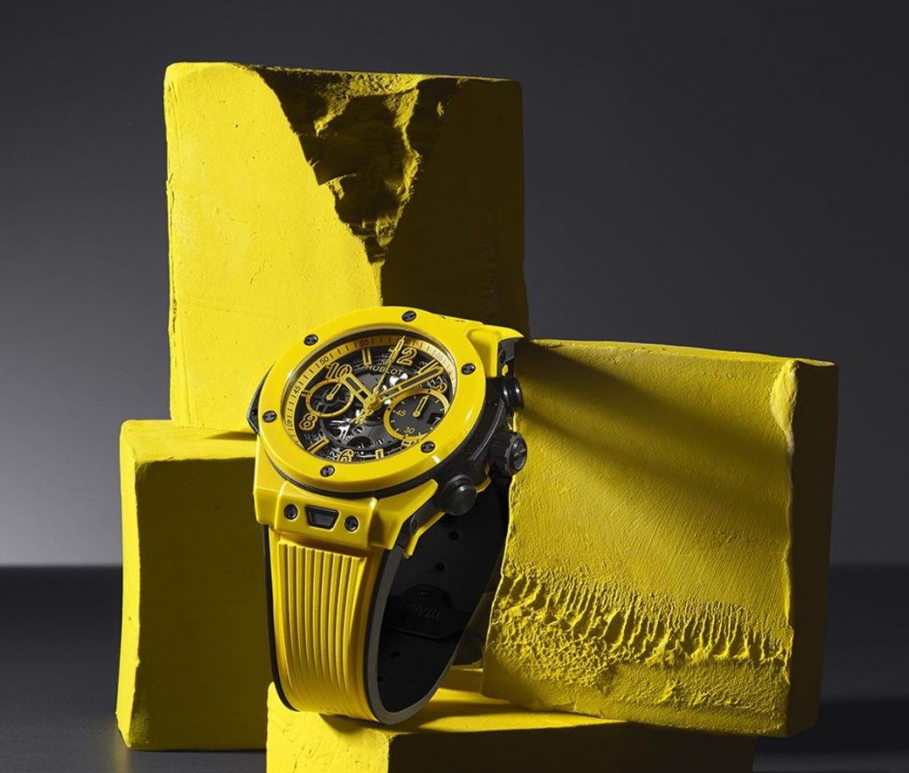 The yellow ceramic fake watch has a hollowed dial.