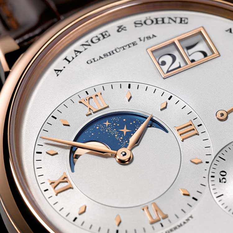 The silvery dial fake watch has moon phase.