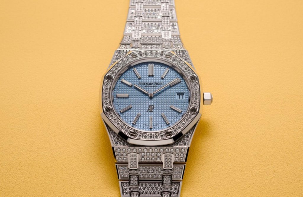 The 18k white gold fake watch has a light blue dial.