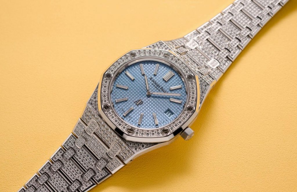 The 39mm fake watch is decorated with diamonds.