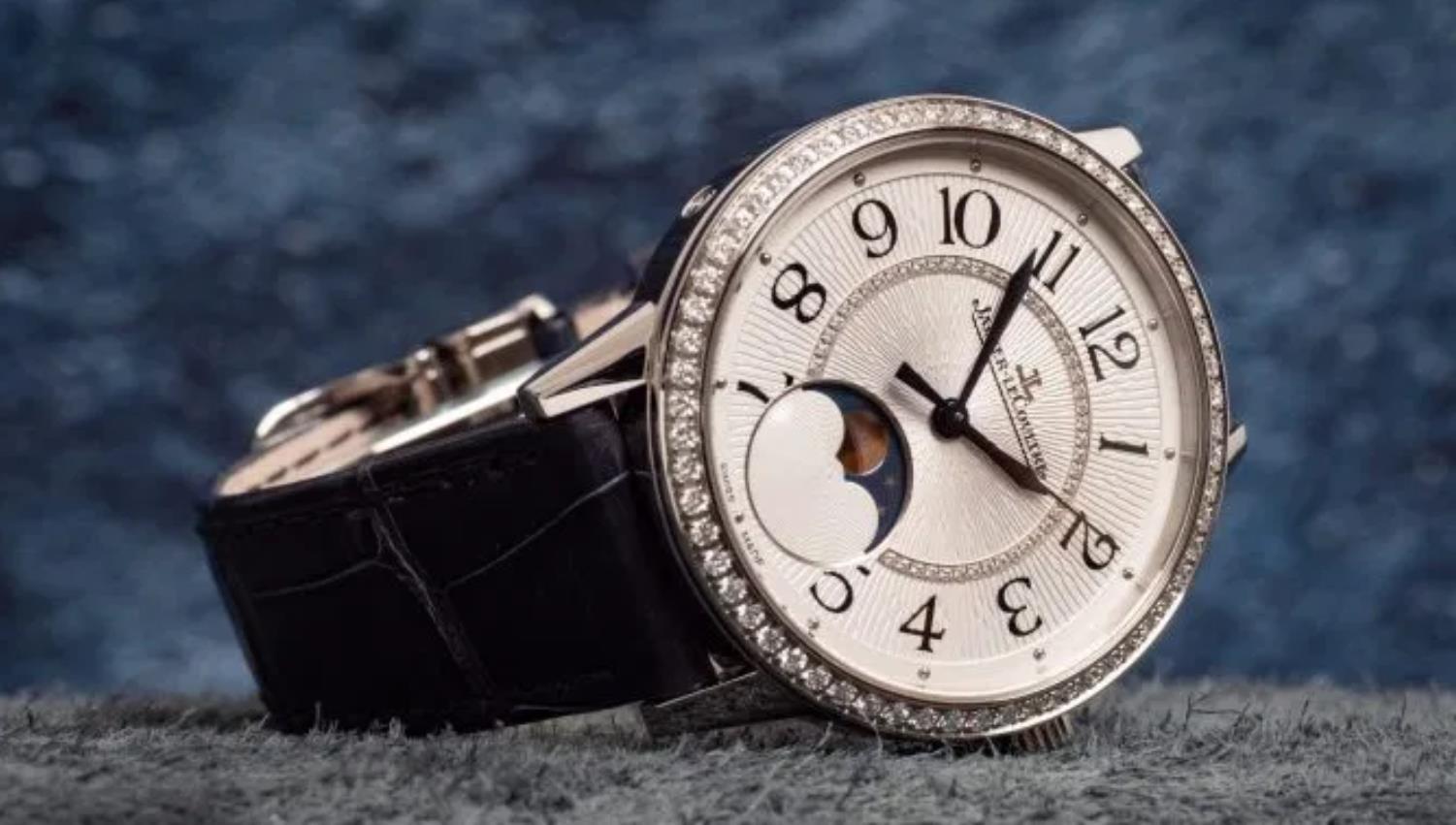 The white dial fake watch has a moon phase.